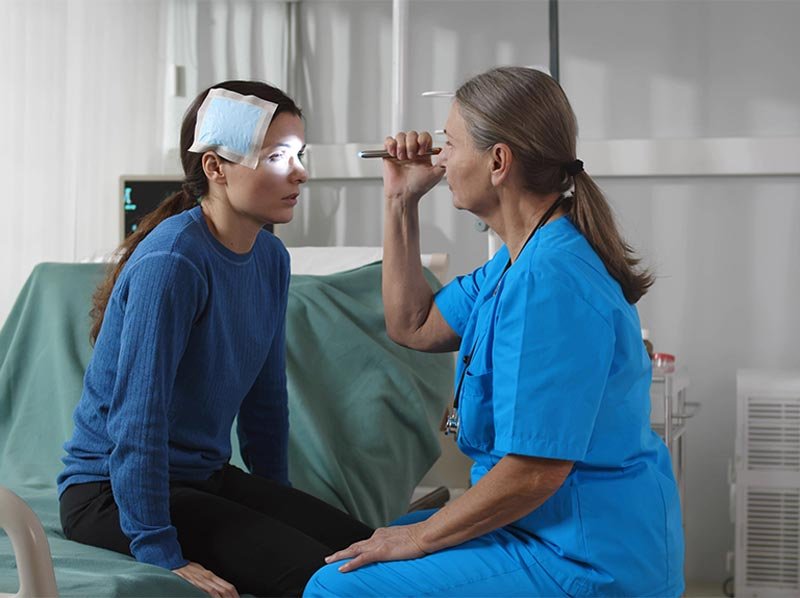 woman being treated by doctor