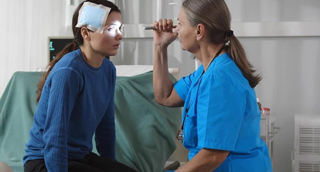 woman being treated by doctor